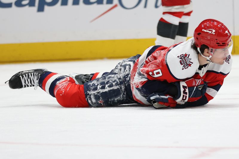 Jan 31, 2026; Washington, District of Columbia, USA; Washington Capitals right wing Ryan Leonard (9) gets called for an interference penalty during the second period against the Carolina Hurricanes at Capital One Arena. Mandatory Credit: Daniel Kucin Jr.-Imagn Images