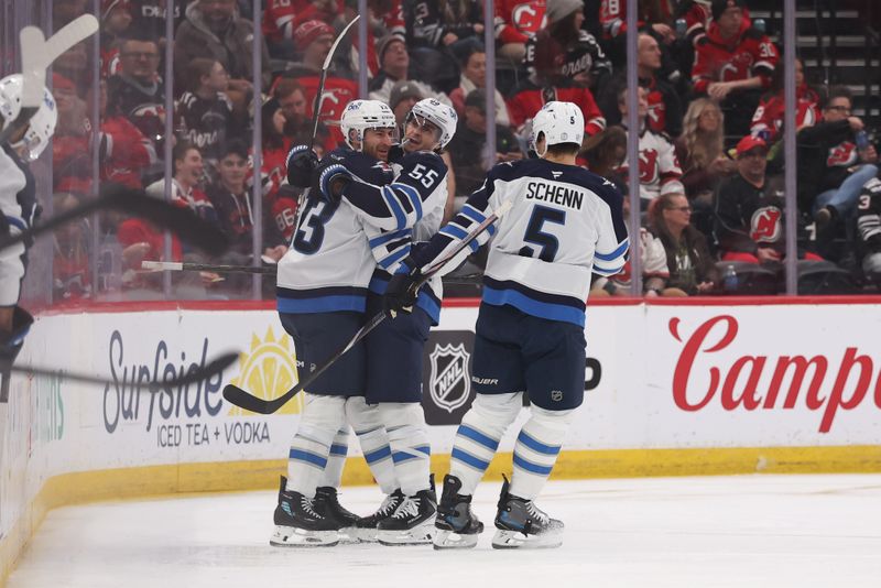 Jan 27, 2026; Newark, New Jersey, USA; Winnipeg Jets center Gabriel Vilardi (13) celebrates his goal against the New Jersey Devils during the second period at Prudential Center. Mandatory Credit: Ed Mulholland-Imagn Images