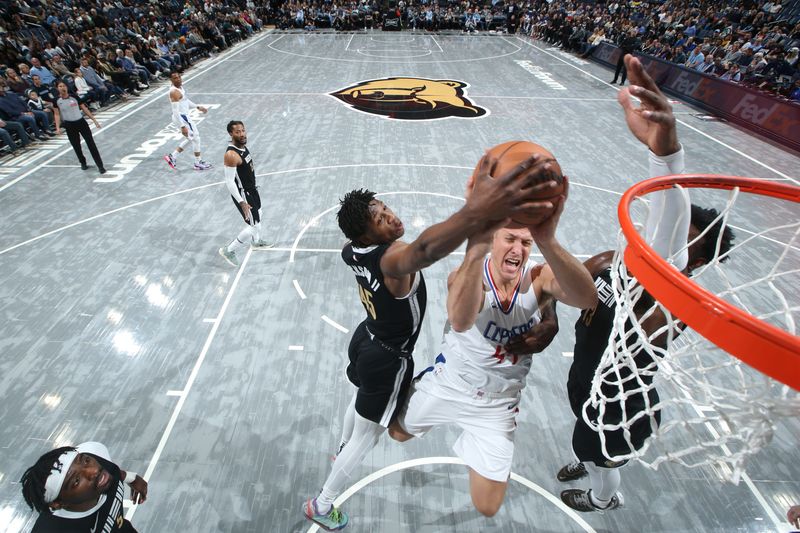 MEMPHIS, TN - FEBRUARY 23: GG Jackson #45 of the Memphis Grizzlies blocks the ball during the game against the LA Clippers on February 23, 2024 at FedExForum in Memphis, Tennessee. NOTE TO USER: User expressly acknowledges and agrees that, by downloading and or using this photograph, User is consenting to the terms and conditions of the Getty Images License Agreement. Mandatory Copyright Notice: Copyright 2024 NBAE (Photo by Joe Murphy/NBAE via Getty Images)