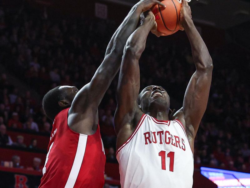 Jan 17, 2024; Piscataway, New Jersey, USA; Nebraska Cornhuskers forward Juwan Gary (4) blocks a shot by Rutgers Scarlet Knights center Clifford Omoruyi (11) during the second half at Jersey Mike's Arena. Mandatory Credit: Vincent Carchietta-USA TODAY Sports