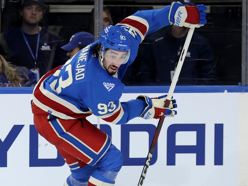 Oct 7, 2025; New York, New York, USA; New York Rangers center Mika Zibanejad (93) skates with the puck against the Pittsburgh Penguins during the third period at Madison Square Garden. Mandatory Credit: Brad Penner-Imagn Images