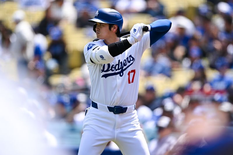 Apr 20, 2024; Los Angeles, California, USA; Los Angeles Dodgers designated hitter Shohei Ohtani (17) on deck against the New York Mets during the first inning at Dodger Stadium. Mandatory Credit: Jonathan Hui-USA TODAY Sports