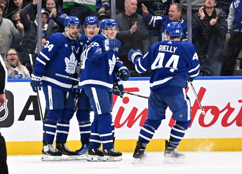 Mar 23, 2024; Toronto, Ontario, CAN; Toronto Maple Leafs forward Pontus Holmberg (29) celebrates with team mates after scoring against the Edmonton Oilers in the second period at Scotiabank Arena. Mandatory Credit: Dan Hamilton-USA TODAY Sports