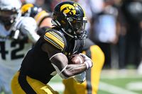 Iowa Hawkeyes Overpower Troy Trojans with Ground and Defense Mastery