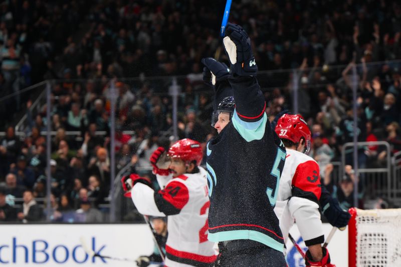 Mar 2, 2026; Seattle, Washington, USA; Seattle Kraken center Ben Meyers (59) celebrates after scoring a goal against the Carolina Hurricanes during the second period at Climate Pledge Arena. Mandatory Credit: Steven Bisig-Imagn Images