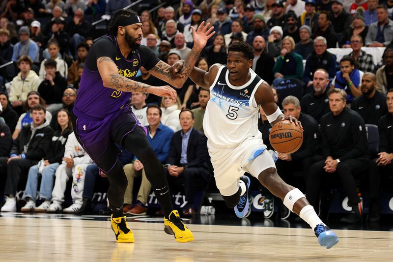 MINNEAPOLIS, MINNESOTA - DECEMBER 02: Anthony Edwards #5 of the Minnesota Timberwolves goes to the basket against Anthony Davis #3 of the Los Angeles Lakers in the first quarter at Target Center on December 02, 2024 in Minneapolis, Minnesota. NOTE TO USER: User expressly acknowledges and agrees that, by downloading and or using this photograph, User is consenting to the terms and conditions of the Getty Images License Agreement. (Photo by David Berding/Getty Images)