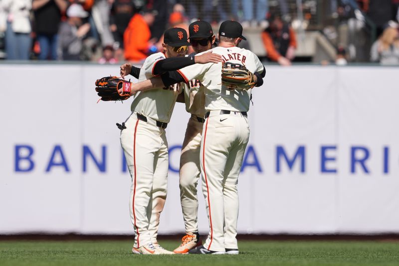 Apr 7, 2024; San Francisco, California, USA; San Francisco Giants center fielder Jung Hoo Lee (center) celebrates with left fielder Michael Conforto (left) and right fielder Austin Slater (right) after defeating the against the San Diego Padres at Oracle Park. Mandatory Credit: Darren Yamashita-USA TODAY Sports