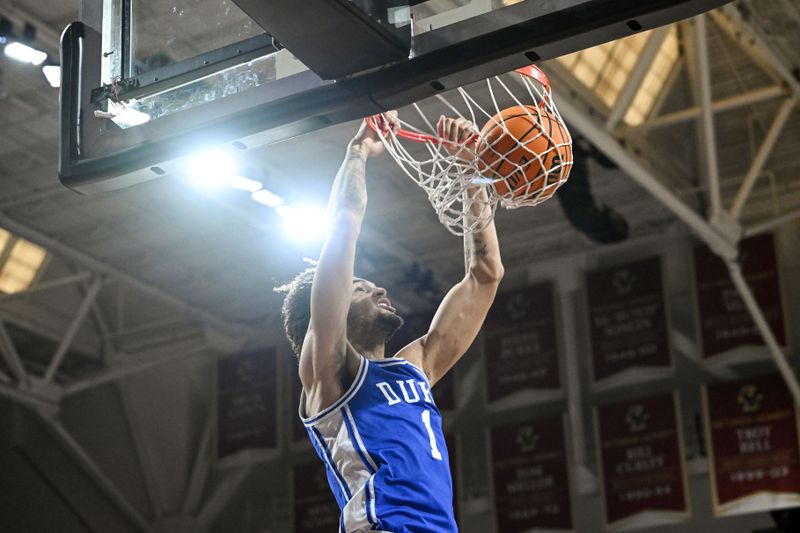 Jan 7, 2023; Chestnut Hill, Massachusetts, USA; Duke Blue Devils center Dereck Lively II (1) dunks and scores against the Boston College Eagles during the first half at the Conte Forum. Mandatory Credit: Brian Fluharty-USA TODAY Sports