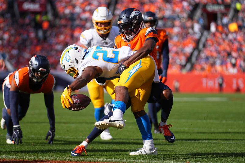 Los Angeles Chargers quarterback Easton Stick (2) runs for a touchdown in the 2nd quarter against the Denver Broncos of an NFL football game Sunday October 13, 2024, in Denver. (AP Photo/Bart Young)