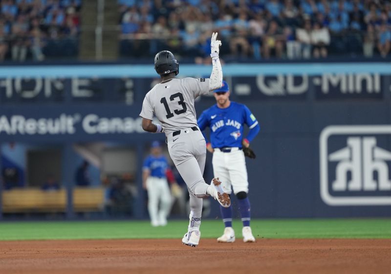Jun 30, 2025; Toronto, Ontario, CAN; New York Yankees third baseman Jazz Chisholm Jr. (13) runs the bases after hitting a two-run home run against the Toronto Blue Jays during the fourth inning at Rogers Centre. Mandatory Credit: Nick Turchiaro-Imagn Images