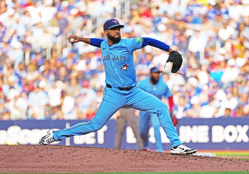 Sep 13, 2025; Toronto, Ontario, CAN; Toronto Blue Jays pitcher Seranthony Domínguez (48) throws a pitch against the Baltimore Orioles during the eighth inning at Rogers Centre. Mandatory Credit: Nick Turchiaro-Imagn Images