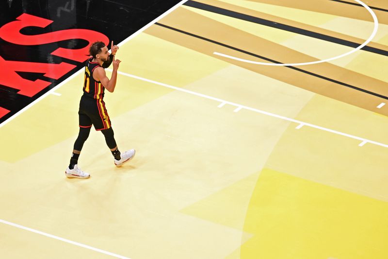 ATLANTA, GA - NOVEMBER 29: Trae Young #11 of the Atlanta Hawks looks on before the game against the Cleveland Cavaliers during the Emirates NBA Cup game on November 29, 2024 at State Farm Arena in Atlanta, Georgia.  NOTE TO USER: User expressly acknowledges and agrees that, by downloading and/or using this Photograph, user is consenting to the terms and conditions of the Getty Images License Agreement. Mandatory Copyright Notice: Copyright 2024 NBAE (Photo by Adam Hagy/NBAE via Getty Images)