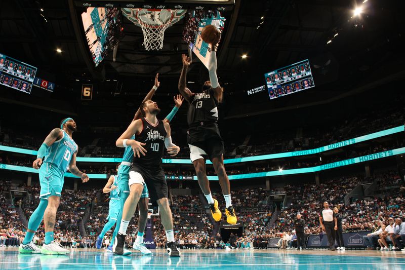 CHARLOTTE, NC - MARCH 31: Paul George #13 of the LA Clippers shoots the ball during the game against the Charlotte Hornets on March 31, 2024 at Spectrum Center in Charlotte, North Carolina. NOTE TO USER: User expressly acknowledges and agrees that, by downloading and or using this photograph, User is consenting to the terms and conditions of the Getty Images License Agreement. Mandatory Copyright Notice: Copyright 2024 NBAE (Photo by Kent Smith/NBAE via Getty Images)