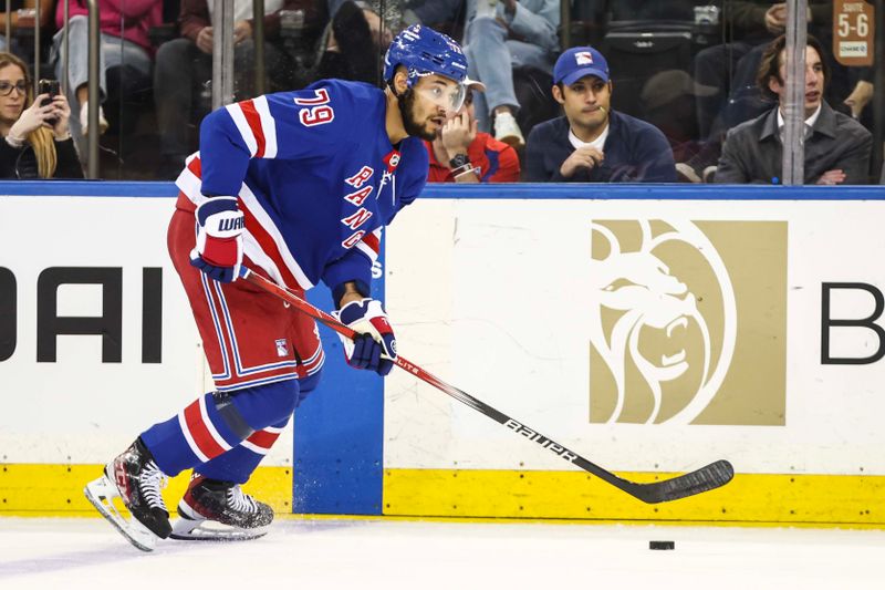 Apr 15, 2024; New York, New York, USA;  New York Rangers defenseman K'Andre Miller (79) controls the puck in the first period against the Ottawa Senators at Madison Square Garden. Mandatory Credit: Wendell Cruz-USA TODAY Sports