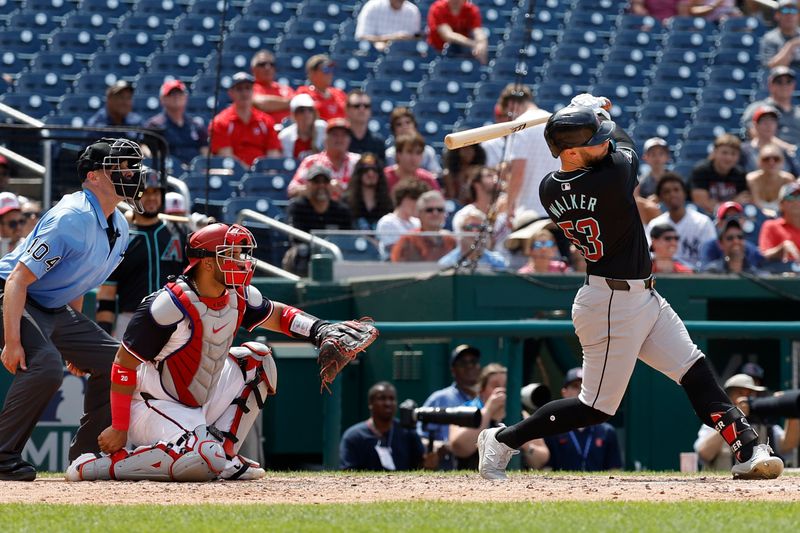 Jun 20, 2024; Washington, District of Columbia, USA; Arizona Diamondbacks first baseman Christian Walker (53) hits a solo home run against the Washington Nationals during the ninth inning at Nationals Park. Mandatory Credit: Geoff Burke-USA TODAY Sports