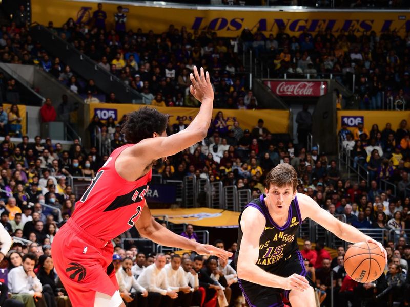 LOS ANGELES, CA - JANUARY 9: Austin Reaves #15 of the Los Angeles Lakers dribbles the ball during the game against the Toronto Raptors on January 9, 2024 at Crypto.Com Arena in Los Angeles, California. NOTE TO USER: User expressly acknowledges and agrees that, by downloading and/or using this Photograph, user is consenting to the terms and conditions of the Getty Images License Agreement. Mandatory Copyright Notice: Copyright 2024 NBAE (Photo by Adam Pantozzi/NBAE via Getty Images)