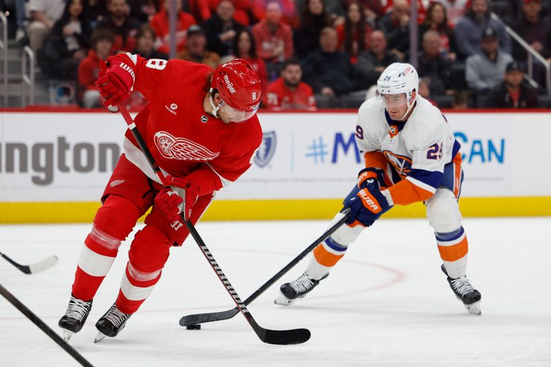 Feb 29, 2024; Detroit, Michigan, USA;  New York Islanders center Brock Nelson (29) skates with the puck defended by Detroit Red Wings defenseman Ben Chiarot (8) in the first period at Little Caesars Arena. Mandatory Credit: Rick Osentoski-USA TODAY Sports