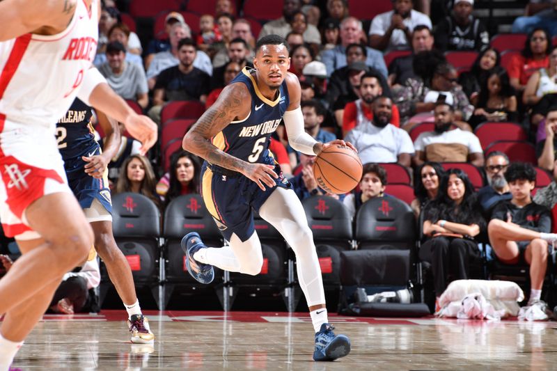 HOUSTON, TX - OCTOBER 15: Fred VanVleet #5 of the Houston Rockets dribbles the ball during the game against the New Orleans Pelicans during a NBA preseason game on October 15, 2024 at the Toyota Center in Houston, Texas. NOTE TO USER: User expressly acknowledges and agrees that, by downloading and or using this photograph, User is consenting to the terms and conditions of the Getty Images License Agreement. Mandatory Copyright Notice: Copyright 2024 NBAE (Photo by Logan Riely/NBAE via Getty Images)