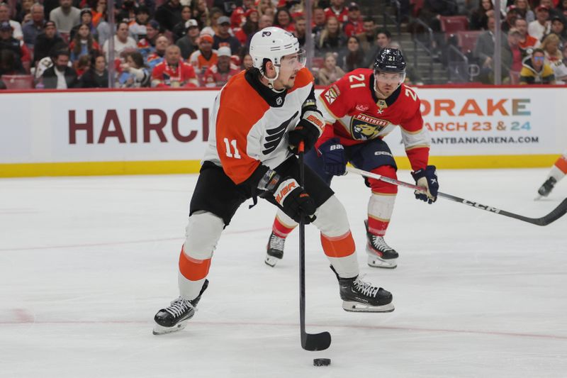 Feb 6, 2024; Sunrise, Florida, USA; Philadelphia Flyers right wing Travis Konecny (11) moves the puck against the Florida Panthers during the second period at Amerant Bank Arena. Mandatory Credit: Sam Navarro-USA TODAY Sports