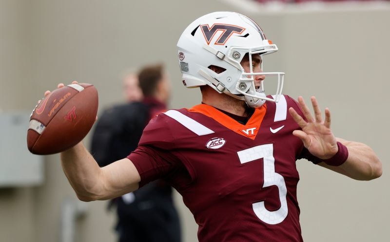 Oct 16, 2021; Blacksburg, Virginia, USA;  Virginia Tech Hokies quarterback Braxton Burmeister (3) throws a warmup pass before the game against the Pittsburgh Panthers at Lane Stadium. Mandatory Credit: Reinhold Matay-USA TODAY Sports