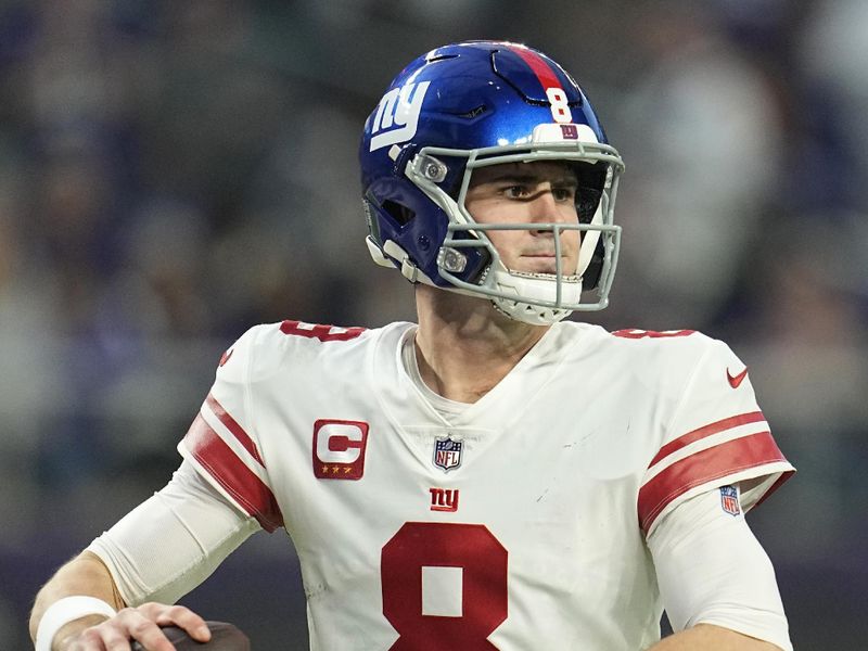 New York Giants quarterback Daniel Jones (8) looks to pass during the first half of an NFL wild-card football game against the Minnesota Vikings, Sunday, Jan. 15, 2023, in Minneapolis. (AP Photo/Abbie Parr)