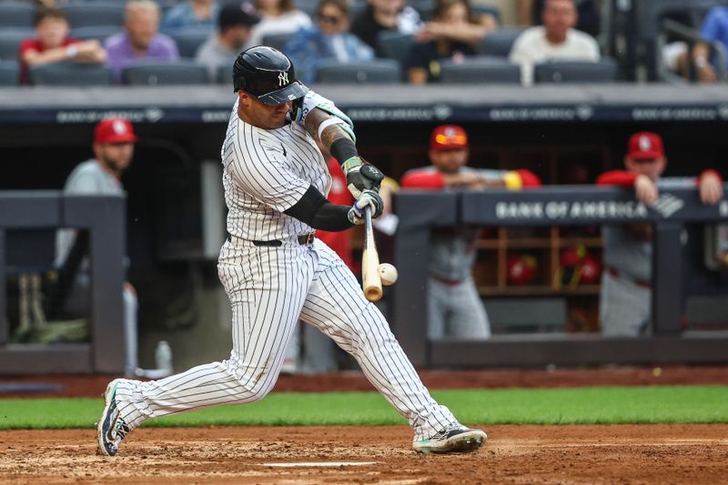 Sep 1, 2024; Bronx, New York, USA;  New York Yankees second baseman Gleyber Torres (25) hits an RBI single in the fifth inning against the St. Louis Cardinals at Yankee Stadium. Mandatory Credit: Wendell Cruz-USA TODAY Sports