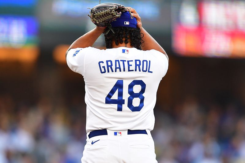 Jun 25, 2023; Los Angeles, California, USA; Los Angeles Dodgers relief pitcher Brusdar Graterol (48) reacts during the tenth inning at Dodger Stadium. Mandatory Credit: Gary A. Vasquez-USA TODAY Sports