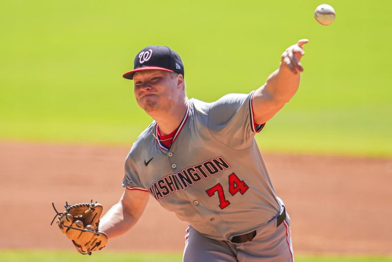 Aug 25, 2024; Cumberland, Georgia, USA; Washington Nationals starting pitcher DJ Herz (74) pitches against the Atlanta Braves during the first inning at Truist Park. Mandatory Credit: Dale Zanine-USA TODAY Sports