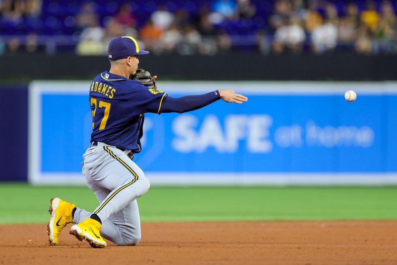 Sep 24, 2023; Miami, Florida, USA; Milwaukee Brewers shortstop Willy Adames (27) throws to second base and retires Miami Marlins third baseman Jake Burger (not pictured) during the first inning at loanDepot Park. Mandatory Credit: Sam Navarro-USA TODAY Sports