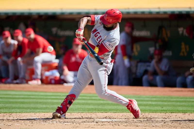 Sep 3, 2023; Oakland, California, USA; Los Angeles Angels infielder Luis Rengifo (2) hits a one run home run against the Oakland Athletics during the seventh inning at Oakland-Alameda County Coliseum. Mandatory Credit: Robert Edwards-USA TODAY Sports