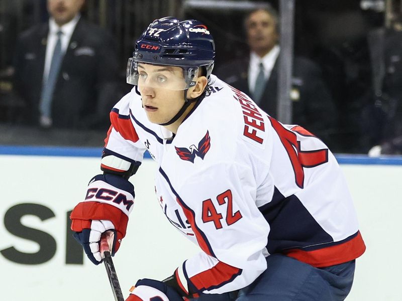 Oct 12, 2025; New York, New York, USA;  Washington Capitals defenseman Martin Fehérváry (42) looks to pass the puck in the second period against the New York Rangers at Madison Square Garden. Mandatory Credit: Wendell Cruz-Imagn Images