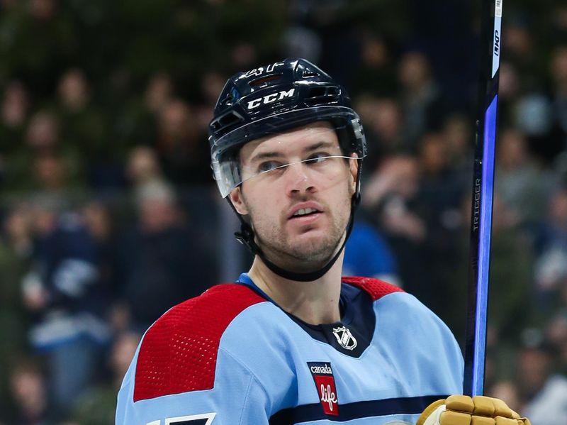 Dec 4, 2023; Winnipeg, Manitoba, CAN;   Winnipeg Jets defenseman Declan Chisholm (47) waits for the face-off against the Carolina Hurricanes during the first period at Canada Life Centre. Mandatory Credit: Terrence Lee-USA TODAY Sports