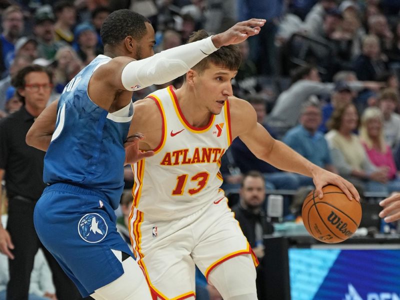 MINNEAPOLIS, MN -  APRIL 12: Bogdan Bogdanovic #13 of the Atlanta Hawks handles the ball during the game against the Minnesota Timberwolves on April 12, 2024 at Target Center in Minneapolis, Minnesota. NOTE TO USER: User expressly acknowledges and agrees that, by downloading and or using this Photograph, user is consenting to the terms and conditions of the Getty Images License Agreement. Mandatory Copyright Notice: Copyright 2024 NBAE (Photo by Jordan Johnson/NBAE via Getty Images)