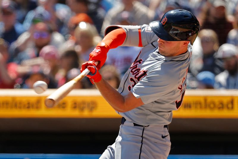 Apr 21, 2024; Minneapolis, Minnesota, USA; Detroit Tigers right fielder Kerry Carpenter (30) hits an RBI single against the Minnesota Twins in the first inning at Target Field. Mandatory Credit: Bruce Kluckhohn-USA TODAY Sports