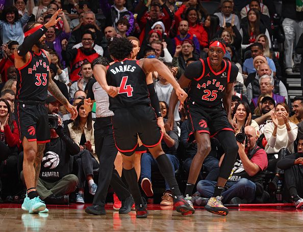 TORONTO, CANADA - DECEMBER 23:  Chris Boucher #25 of the Toronto Raptors reacts during the game against the Utah Jazz on December 23, 2023 at the Scotiabank Arena in Toronto, Ontario, Canada.  NOTE TO USER: User expressly acknowledges and agrees that, by downloading and or using this Photograph, user is consenting to the terms and conditions of the Getty Images License Agreement.  Mandatory Copyright Notice: Copyright 2023 NBAE (Photo by Vaughn Ridley/NBAE via Getty Images)