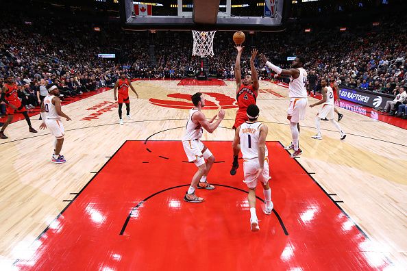 TORONTO, CANADA - NOVEMBER 29: Scottie Barnes #4 of the Toronto Raptors shoots the ball during the game against the Phoenix Suns on November 29, 2023 at the Scotiabank Arena in Toronto, Ontario, Canada.  NOTE TO USER: User expressly acknowledges and agrees that, by downloading and or using this Photograph, user is consenting to the terms and conditions of the Getty Images License Agreement.  Mandatory Copyright Notice: Copyright 2023 NBAE (Photo by Vaughn Ridley/NBAE via Getty Images)