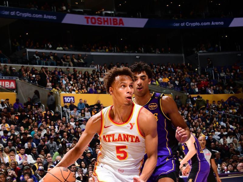 LOS ANGELES, CA - JANUARY 3:  Dyson Daniels #5 of the Atlanta Hawks handles the ball during the game against the Los Angeles Lakers on January 3, 2025 at Crypto.Com Arena in Los Angeles, California. NOTE TO USER: User expressly acknowledges and agrees that, by downloading and/or using this Photograph, user is consenting to the terms and conditions of the Getty Images License Agreement. Mandatory Copyright Notice: Copyright 2025 NBAE (Photo by Adam Pantozzi/NBAE via Getty Images)