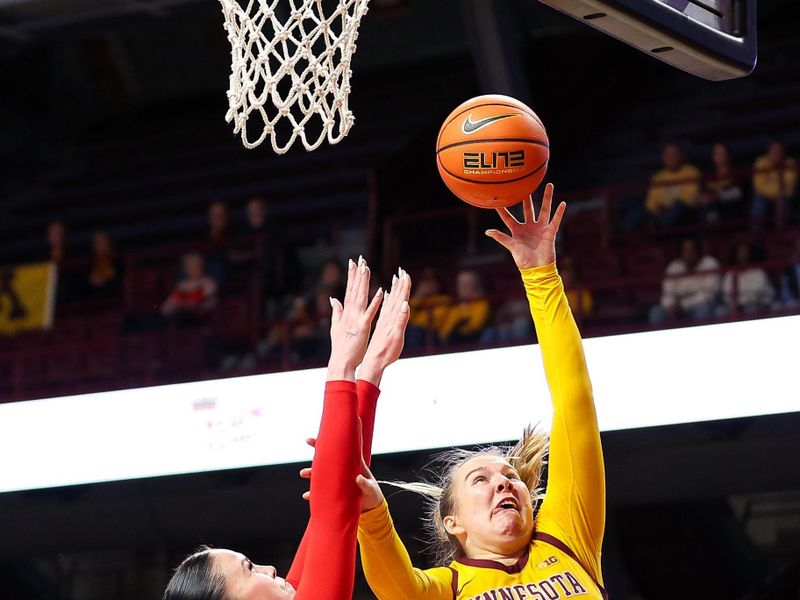 Feb 8, 2024; Minneapolis, Minnesota, USA; Minnesota Golden Gophers center Sophie Hart (52) shoots as Ohio State Buckeyes forward Rebeka Mikulasikova (23) during the first half at Williams Arena. Mandatory Credit: Matt Krohn-USA TODAY Sports