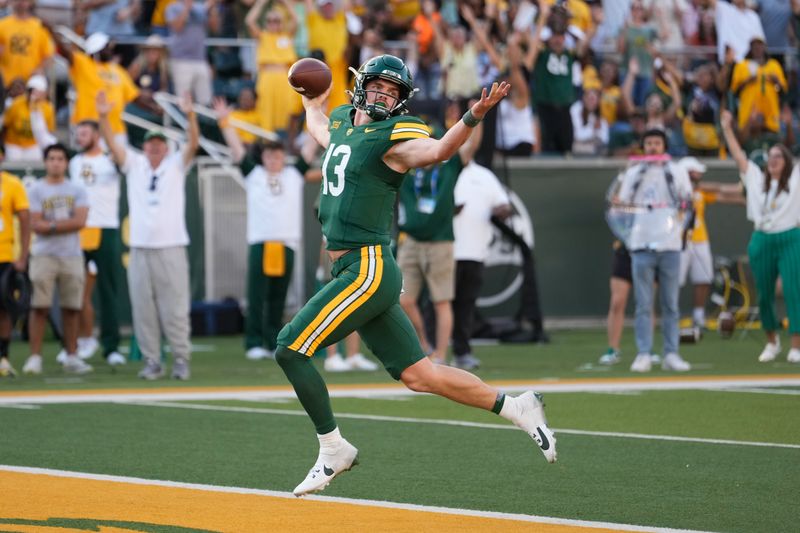 Oct 26, 2024; Waco, Texas, USA; Baylor Bears quarterback Sawyer Robertson (13) celebrates after scoring a 41 yard touchdown  against the Oklahoma State Cowboys during the second half at McLane Stadium. Mandatory Credit: Chris Jones-Imagn Images