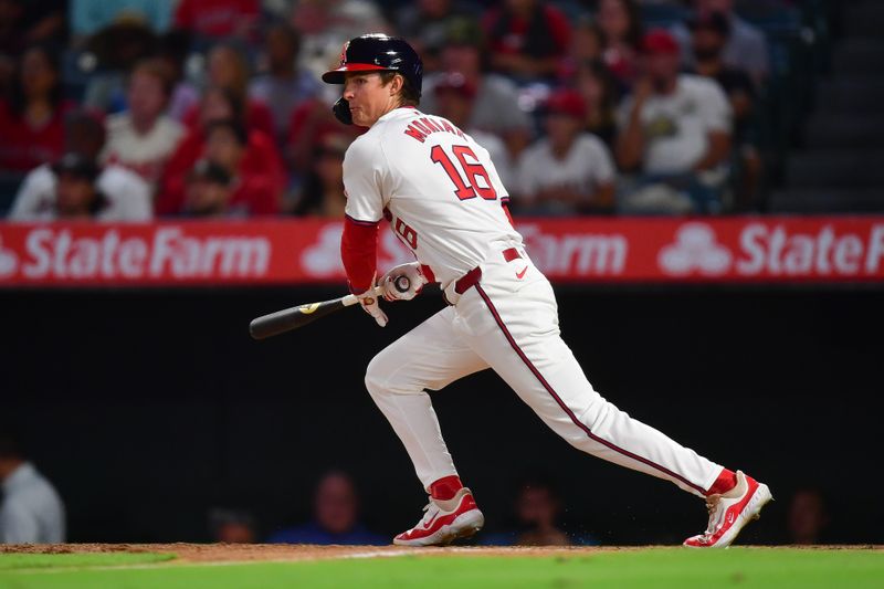 Jul 26, 2024; Anaheim, California, USA; Los Angeles Angels center fielder Mickey Moniak (16) hits a single against the Oakland Athletics during the ninth inning at Angel Stadium. Mandatory Credit: Gary A. Vasquez-USA TODAY Sports