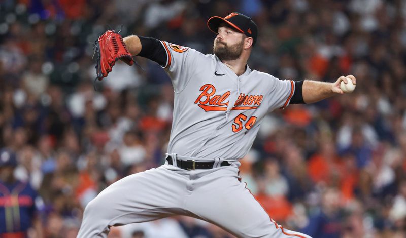 Sep 18, 2023; Houston, Texas, USA; Baltimore Orioles relief pitcher Danny Coulombe (54) delivers a pitch during the seventh inning against the Houston Astros at Minute Maid Park. Mandatory Credit: Troy Taormina-USA TODAY Sports