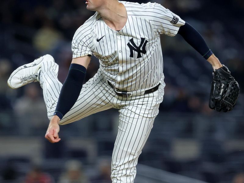 Apr 19, 2024; Bronx, New York, USA; New York Yankees relief pitcher Clay Holmes (35) follows through on a pitch against the Tampa Bay Rays during the ninth inning at Yankee Stadium. Mandatory Credit: Brad Penner-USA TODAY Sports