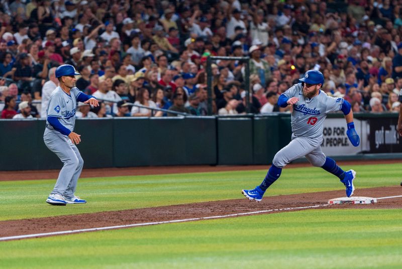Aug 30, 2024; Phoenix, Arizona, USA; Los Angeles Dodgers shortstop Max Muncy (13) comes in to score in the first inning during a game against the Arizona Diamondbacks at Chase Field. Mandatory Credit: Allan Henry-USA TODAY Sports