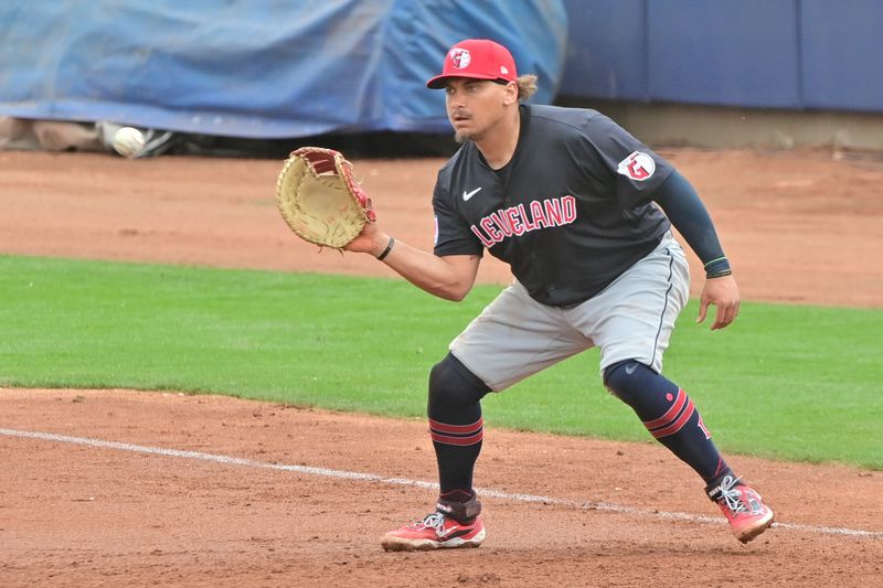 Feb 26, 2024; Peoria, Arizona, USA;  Cleveland Guardians first baseman Josh Naylor (22) catches the ball for an out in the third inning against the San Diego Padres during a spring training game at Peoria Sports Complex. Mandatory Credit: Matt Kartozian-USA TODAY Sports