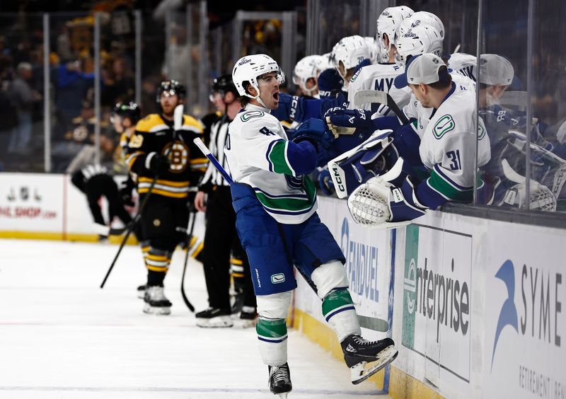 Nov 26, 2024; Boston, Massachusetts, USA; Vancouver Canucks right wing Conor Garland (8) celebrates his empty net goal against the Boston Bruins during the third period of their 2-0 win at TD Garden. Mandatory Credit: Winslow Townson-Imagn Images