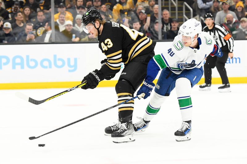 Feb 8, 2024; Boston, Massachusetts, USA; Boston Bruins left wing Danton Heinen (43) skates past Vancouver Canucks center Elias Pettersson (40) during the first period at TD Garden. Mandatory Credit: Bob DeChiara-USA TODAY Sports