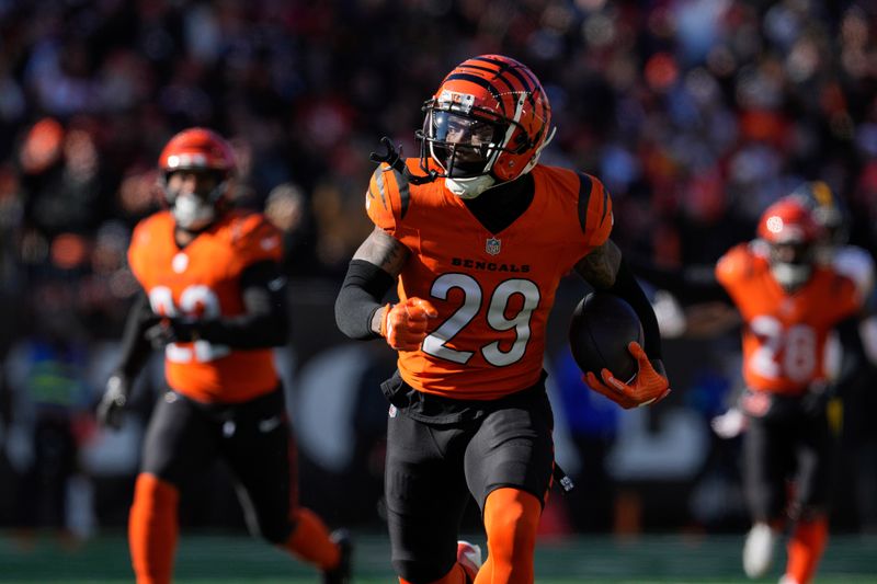 Cincinnati Bengals cornerback Cam Taylor-Britt (29) returns an interception for a touchdown during the first half of an NFL football game against the Pittsburgh Steelers, Sunday, Dec. 1, 2024, in Cincinnati. (AP Photo/Jeff Dean)