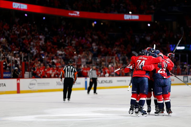 Apr 13, 2024; Washington, District of Columbia, USA; Washington Capitals left wing Sonny Milano (15) celebrates with teammates after scoring a goal against the Tampa Bay Lightning in the first period at Capital One Arena. Mandatory Credit: Geoff Burke-USA TODAY Sports