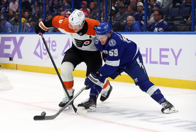 Nov 24, 2025; Tampa, Florida, USA; Philadelphia Flyers defenseman Travis Sanheim (6) defends Tampa Bay Lightning center Jake Guentzel (59) during the first period at Benchmark International Arena. Mandatory Credit: Kim Klement Neitzel-Imagn Images