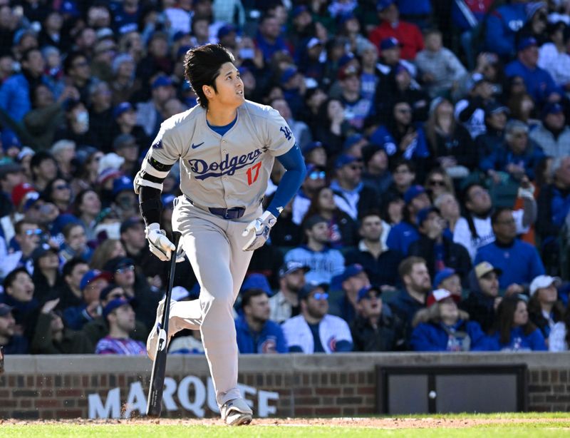 Apr 6, 2024; Chicago, Illinois, USA;  Los Angeles Dodgers two-way player Shohei Ohtani (17) watches his foul ball during the third inning against the Chicago Cubs at Wrigley Field. Mandatory Credit: Matt Marton-USA TODAY Sports